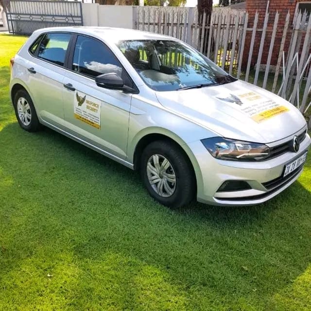 Marked SbuForce Security patrol vehicle parked on site